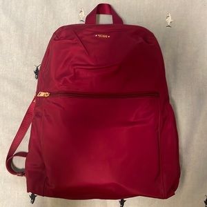 TUMI maroon backpack. Never used.